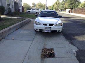 parking up on the sidewalk with rolled curb