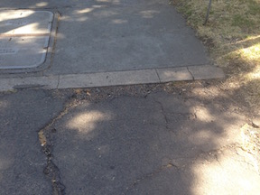 deteriorated pavement at alley