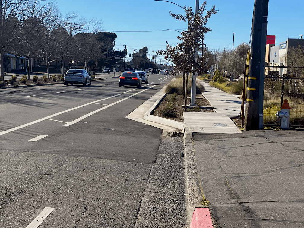 Freeport Blvd at Rally's, sidewalk buffer and wide sidewalk