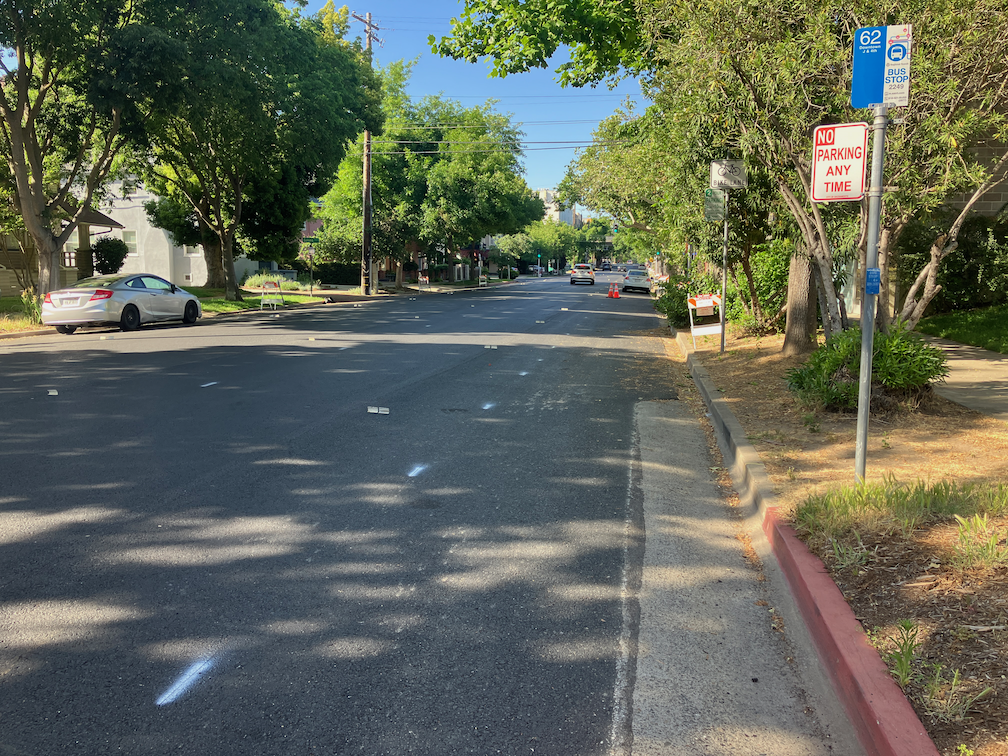 21st St bus stop, marked as though it were a parking lane