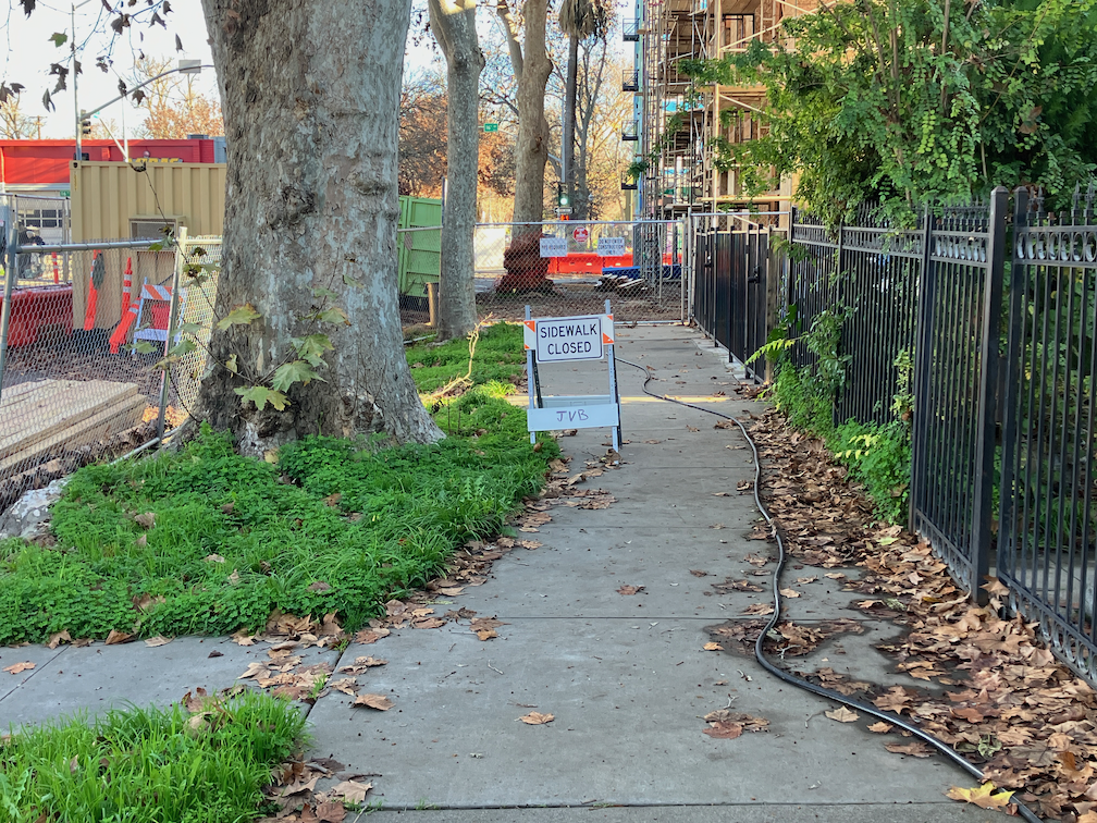 photo of E St south side sidewalk closed sign