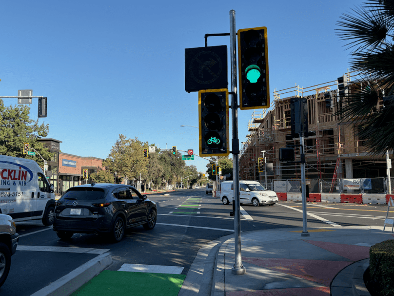 photo of Broadway eastbound at Land Park Dr, signal, bike signal, blanked-out no-right-turn