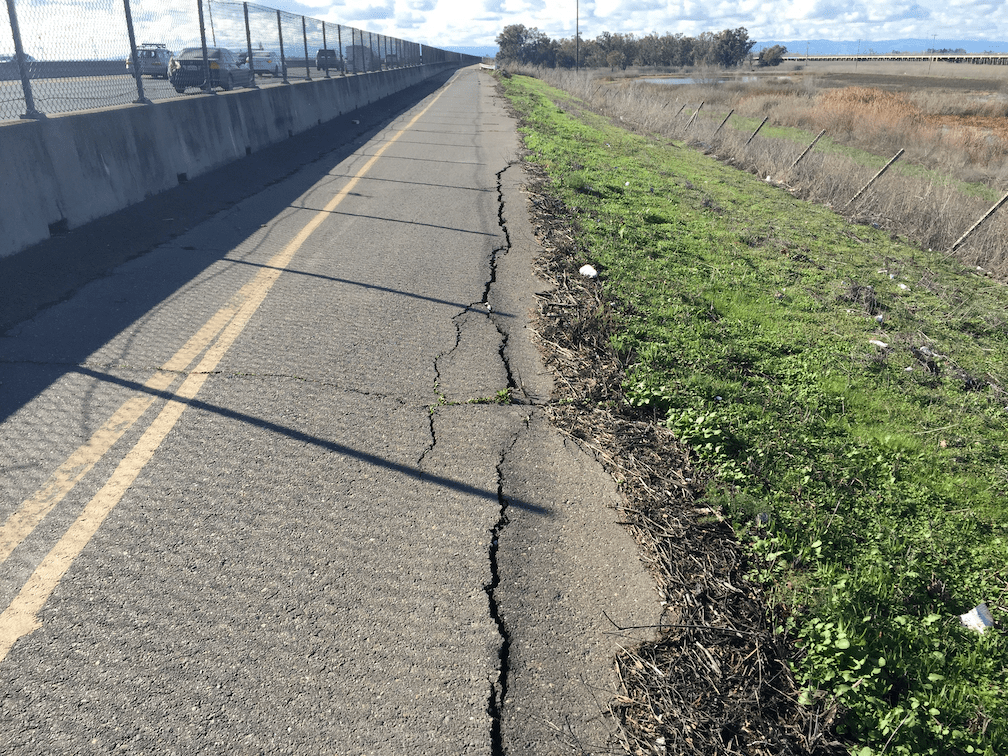 photo of deteriorated pavement and cracks