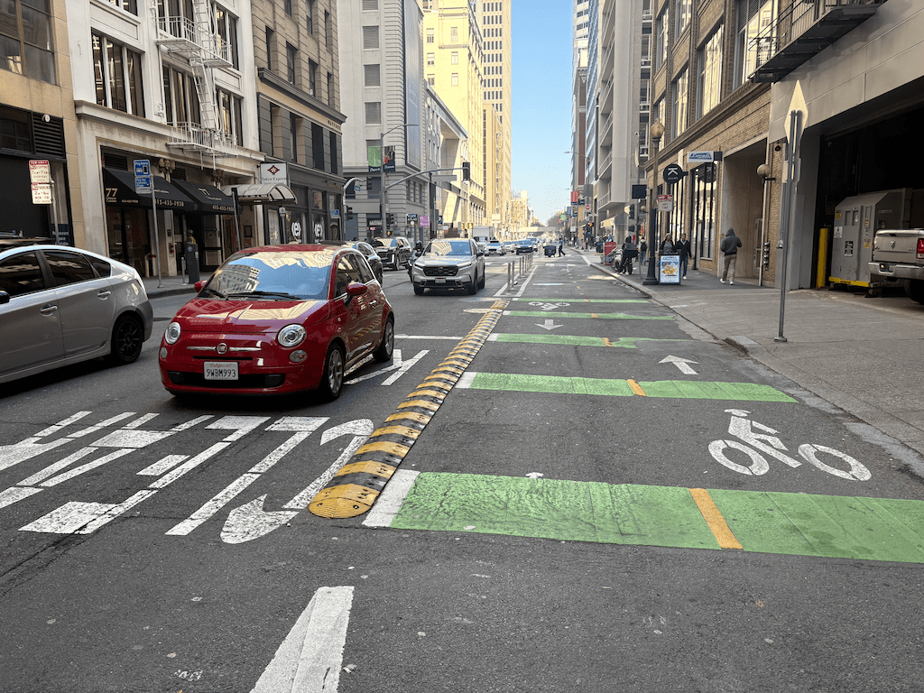 photo of speed bumps across driveway on Battery St bikeway