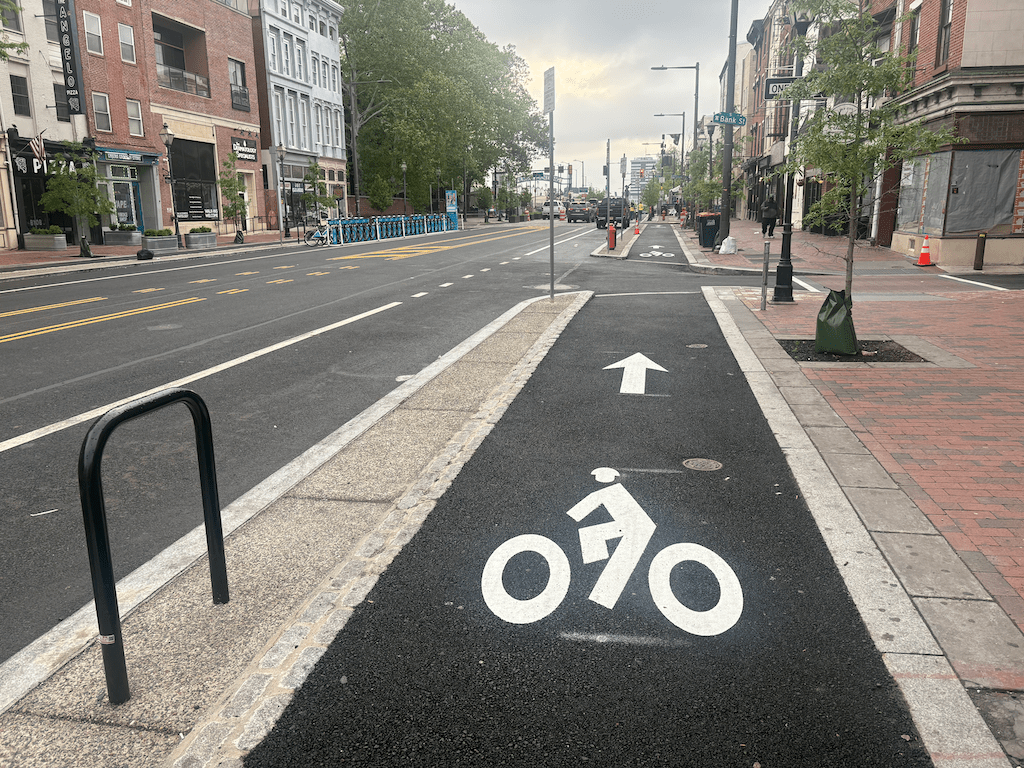 photo of sidewalk-level bikeway on Market St in Philadelphia